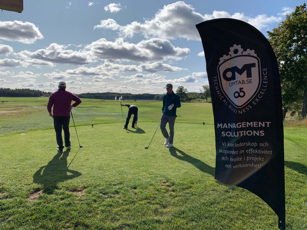 Persons playing golf